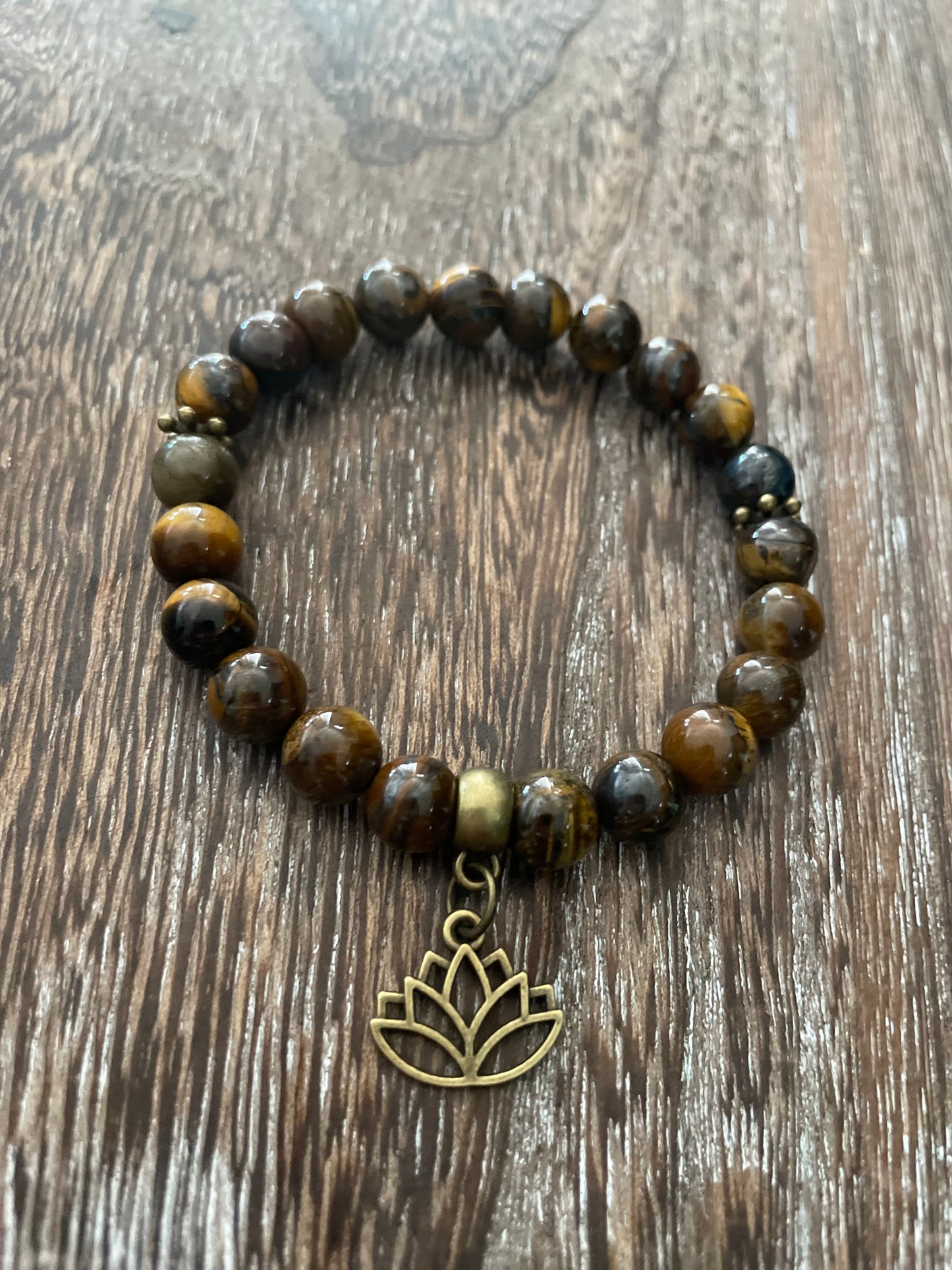 Tiger eye with lotus charm